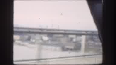 Kansas-1958: Radiographer Inside Car Driving Over Bridge