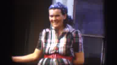 Kansas (1958): Lady Wearing A Blue Banana On Her Head Holding A Door And Looking