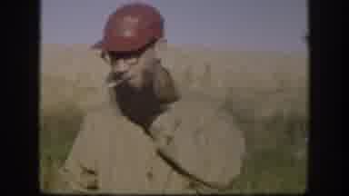 Kansas (1958): Man Smoking A Cigarette Address The Camera Then The Other Man Lifts