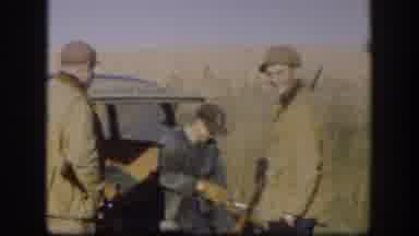 Kansas (1958): Hunters With Shotguns Stand And Sit Around The Tailgate Of A