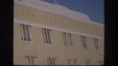 Kansas (1958): Double Doors At The Front Of A Building Long Wall With Many Windows
