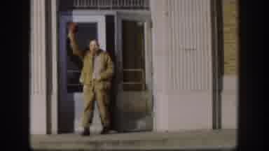 Kansas (1958): A Working Man On A Sunny Day Smoking A Cigar Waving Hello