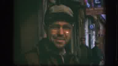 Kansas (1958): Man Looks Into Camera Slowly Looks Away Two Other Men Visible In