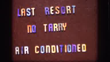 Kansas (1958): Sign Reads Last Resort No Tarry Air Conditioned Maroon Background