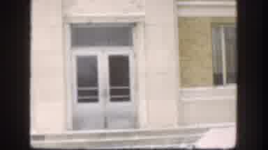 Kansas (1958): Man Walking Through Windy Snowy Weather Towards Building In Vintage