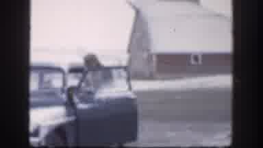 Kansas (1958): A Man Dressed In A Coat And Hat Exits A Vintage Car Dusted With