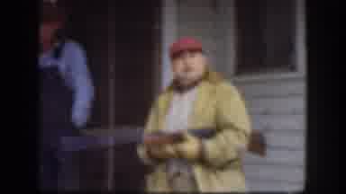 Kansas (1958): Guy Mimics Shooting A Gun While Standing On His Porch With A Friend