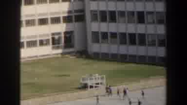 Israel (1960): People Walking Towards White Modern Building On A Sunny Day