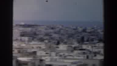 Israel (1960): A Group Of People Walk Around The Inside Of A Bustling City That