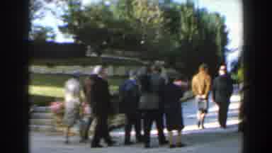 Israel (1960): Small Group Of People Walking In A Park With Different Flowers And