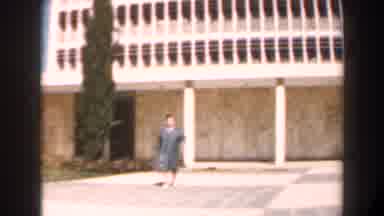 Israel (1960): Person Walking Out Of Building Towards The Camera
