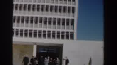 Israel (1960): People Waiting Outside A Large Building To Open In The Morning