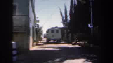 Israel (1960): A White Van And A Green Car Parked On A Small City Street With