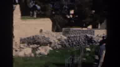 Israel (1960): Some People Walking Along A Fenced Section And Old Stone Buildings