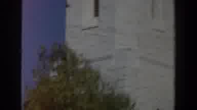 Israel (1960): View Of White Stone Bell Tower And Tree On A Sunny Day