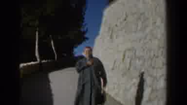 Israel (1960): Excited Woman Unties Her Coat As She Walks Toward The Camera