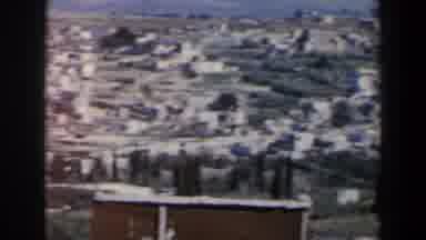 Israel (1960): A Bunch Of Structures Sits In A Barren Dry Countryside On A Sunny