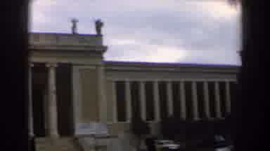 Israel (1960): View Of Four Objects On Rooftop Of Tan Building On A Cloudy Day