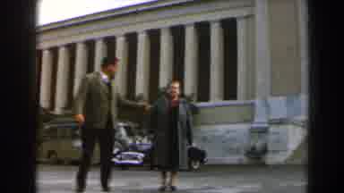 Israel (1960): Couple Walking In Front Of Beautiful Building And Cars Passing