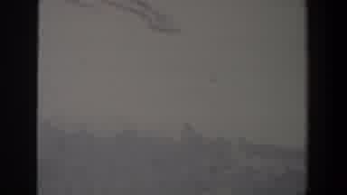 Israel (1960): Unclear Footage Of A Foggy City Showing Men And Women Waiting For A