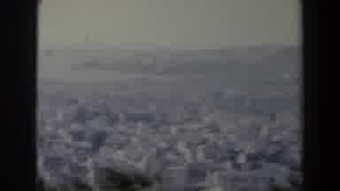 Israel (1960): Body Of Water With Rocky Shore And Spare Evergreen Shrubs And Trees