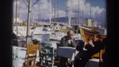 Israel (1960): People Sitting Relaxed Socializing And Eating With Several Ships In