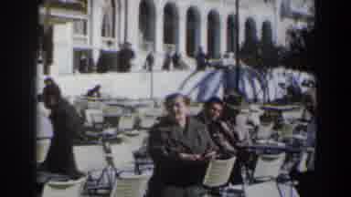 Israel (1960): People Walking In Background People Sitting In Courtyard