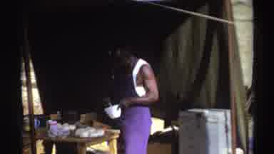 South Africa (1969): Two Black Men In A Tent Preparing Some Type Of Food