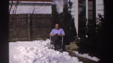 Michigan (1969): Man Looking At Camera And Sitting Next To Snow