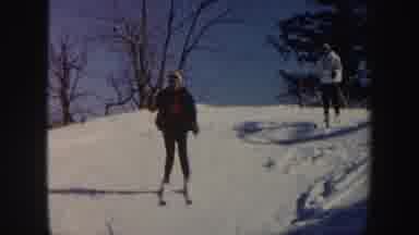 Vermont (1962): A Man Woman Skiing Down A Sunny Hill Showing Us The Geography Of