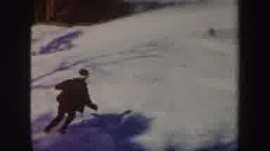 Vermont (1962): Two People Skiing Downhill At A Resort Around A Pond