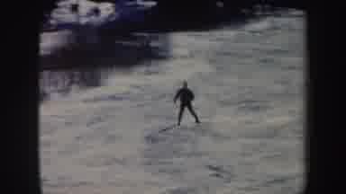 Vermont (1962): People Skiing On The Snow-Covered Mountain Surrounded By Trees