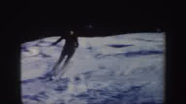 Vermont (1962): Woman In Maroon Top And Black Hat And Black Pants Skiing Down