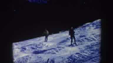 Vermont (1962): A Person Dressed In Yellow And A Red Cap Skiing With Speed On Snow