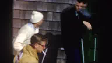 Vermont (1962): Two People Downhill Skiing On A Tree-Lined Trail Family At The Ski