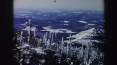 Vermont (1962): A Ski Lift Passes By Large Snowy Mountains In The Distances