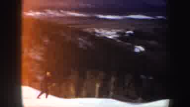 Vermont (1962): A Man Wearing Black Is Skiing Skillfully Down The Snowy Mountain