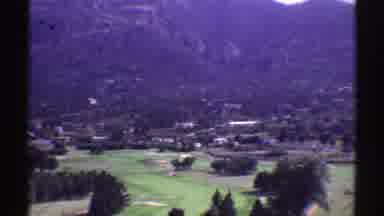 Colorado (1969): View Of Mountain Base Green Trees And Grass On A Clear Day