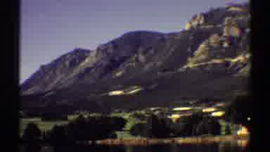 Colorado (1969): Mountain Side With Green Grass Trees And Houses Are Peppered