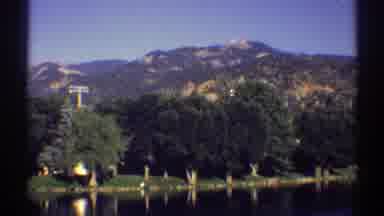 Colorado (1969): A Beautiful Row Of Trees Are Lining A Clear Lake