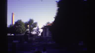 Colorado (1969): Panoramic View Of People Sitting In Nos Park Chairs With Houses
