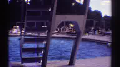 Colorado (1969): Swimmers Enjoying A Public Pool With A Diving Board On A Busy