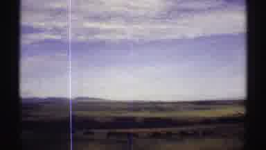 Colorado (1969): Passing View Of Green Fields Blue Sky And White Clouds On A Clear