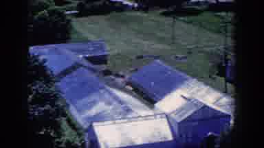 French Lick Indiana (1958): View Of Silver Greenhouses And Green Trees On A Bright