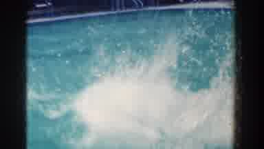 French Lick Indiana (1958): Man Having Fun Jumping Into A Pool With Friends In