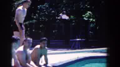 French Lick Indiana (1958): People Sitting Together By The Pool And Man Jumping