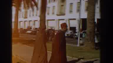 CASABLANCA-1959: Two Men In Traditional Attire Walk Along A Sunlit Street