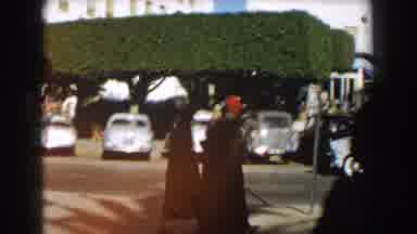 CASABLANCA-1959: Cars And People On A Busy Urban Street Pass A Building With Pillars And Windows