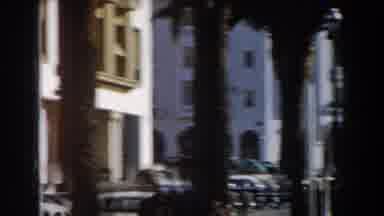 CASABLANCA-1959: The Camera Pans Across Palm Trees And Colonial Buildings