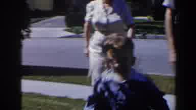 Las Vegas (1958): Boy Wearing Blue Suit Walks In Front Of Woman Wearing White